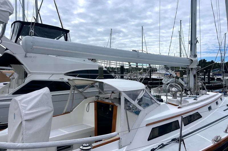 Slide: The Image of Sailboat Alden 43, 1993 model, docked at marina with overcast sky. - 29