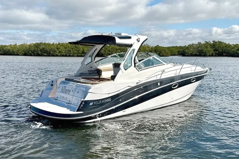 Slide: The Image of A sleek motorboat cruising on calm waters. It features a modern design and spacious cabin. - 1