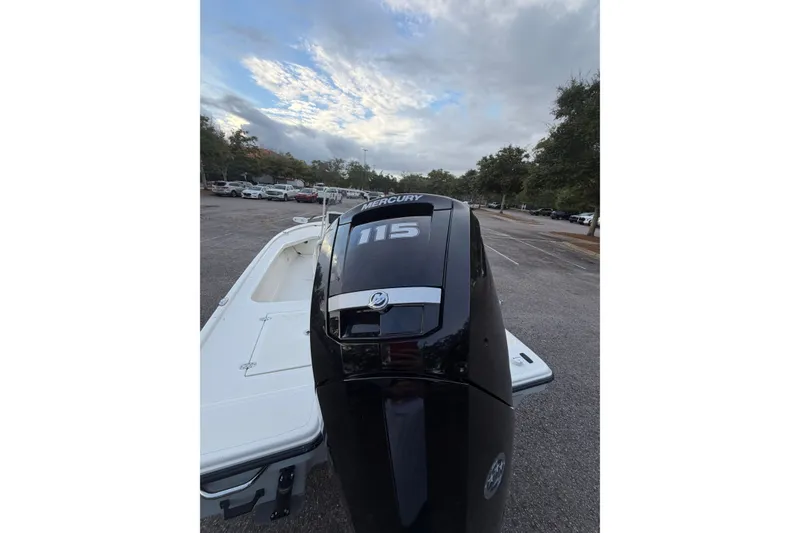 Slide: The Image of 2025 Mako 18 LTS boat with Mercury 115 engine in parking lot. - 9