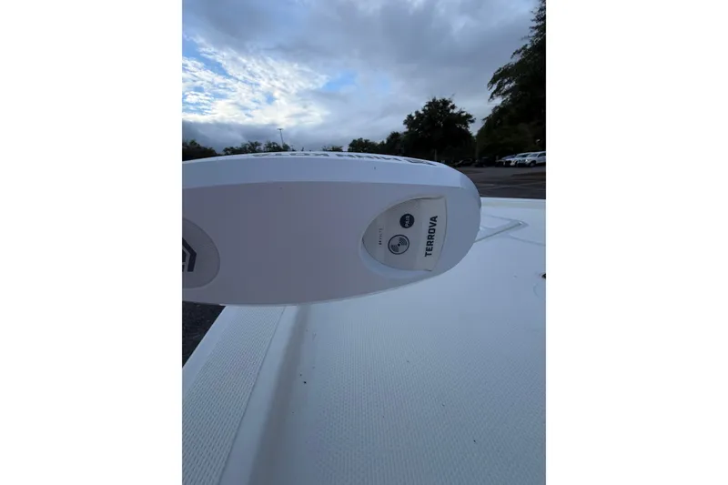 Slide: The Image of 2025 Mako 18 LTS boat with Terrova trolling motor, under cloudy sky. - 4
