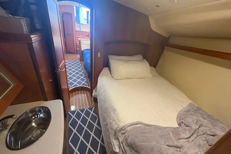 Slide: The Image of Cozy cabin interior of 2007 Hunter 41 Deck Salon yacht with bed and sink. - 23