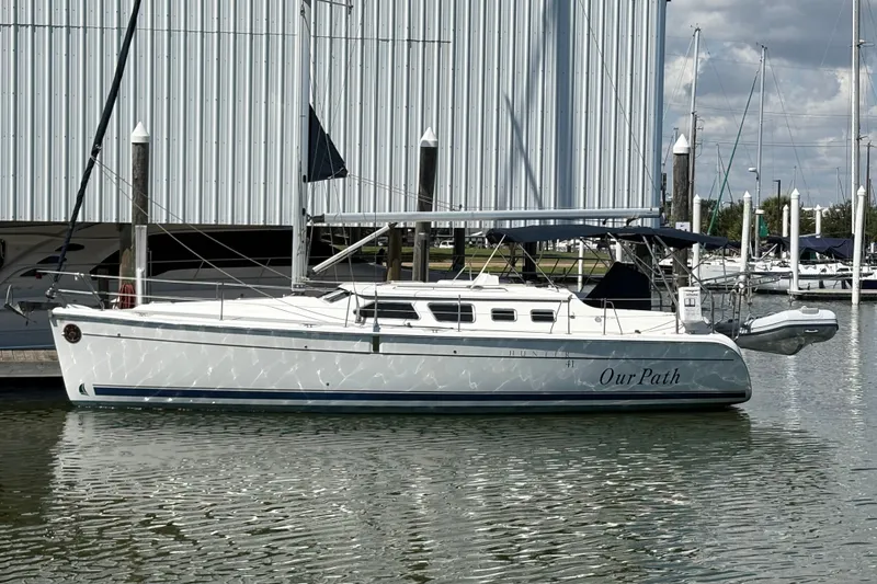 Slide: The Image of 2007 Hunter 41 Deck Salon sailboat docked at marina, named "Our Path." - 27