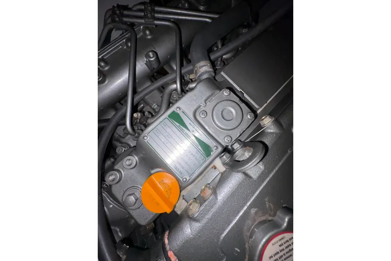 Slide: The Image of Engine component of a 2007 Hunter 41 Deck Salon sailboat, featuring detailed mechanical parts. - 29