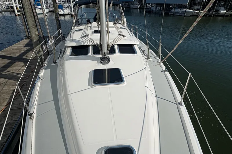 Slide: The Image of 2007 Hunter 41 Deck Salon sailboat docked at marina, top deck view. - 9
