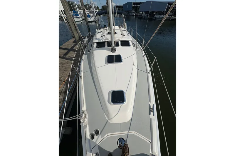 Slide: The Image of 2007 Hunter 41 Deck Salon sailboat docked at marina, viewed from deck. - 12