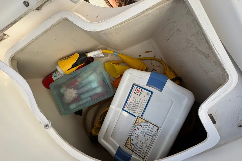 Slide: The Image of Storage compartment of 2007 Hunter 41 Deck Salon with safety equipment and cables. - 3
