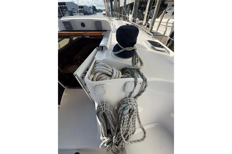 Slide: The Image of 2007 Hunter 41 Deck Salon sailboat deck with ropes and winch. - 2