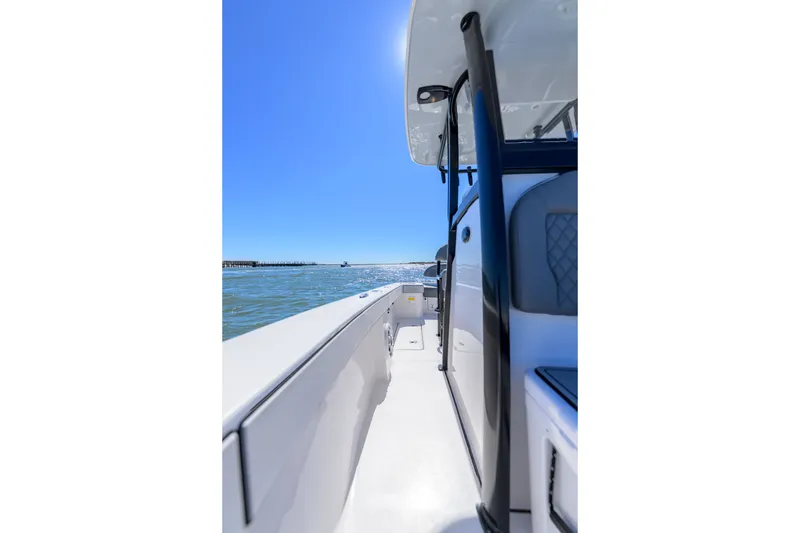 Slide: The Image of 2025 Delta Boatworks D245 on water, showcasing sleek design and modern features under clear blue sky. - 13