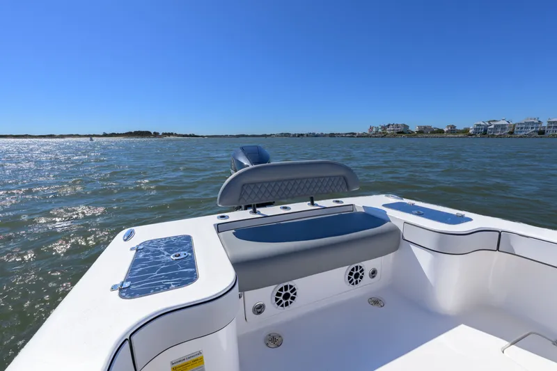 Slide: The Image of 2025 Delta Boatworks D245 on calm waters, showcasing sleek design and modern features. - 19