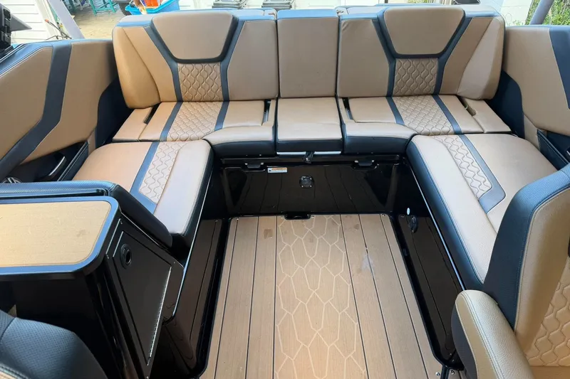 Slide: The Image of Luxurious interior seating of 2026 Ymaha 255 boat with beige and black upholstery. - 7