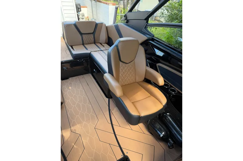 Slide: The Image of Luxurious interior of 2026 Ymaha 255 boat with tan leather seating and modern design. - 8