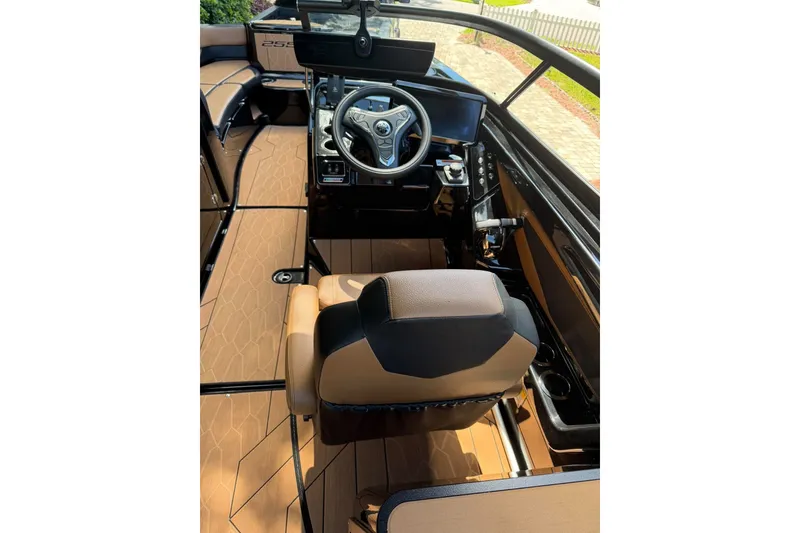 Slide: The Image of Interior view of 2026 Ymaha 255 boat, featuring sleek steering and modern dashboard. - 14