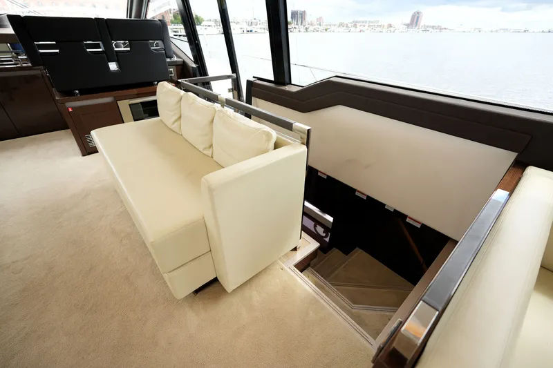 Slide: The Image of Luxurious interior of 2023 Prestige 690 yacht with elegant seating and staircase. - 101