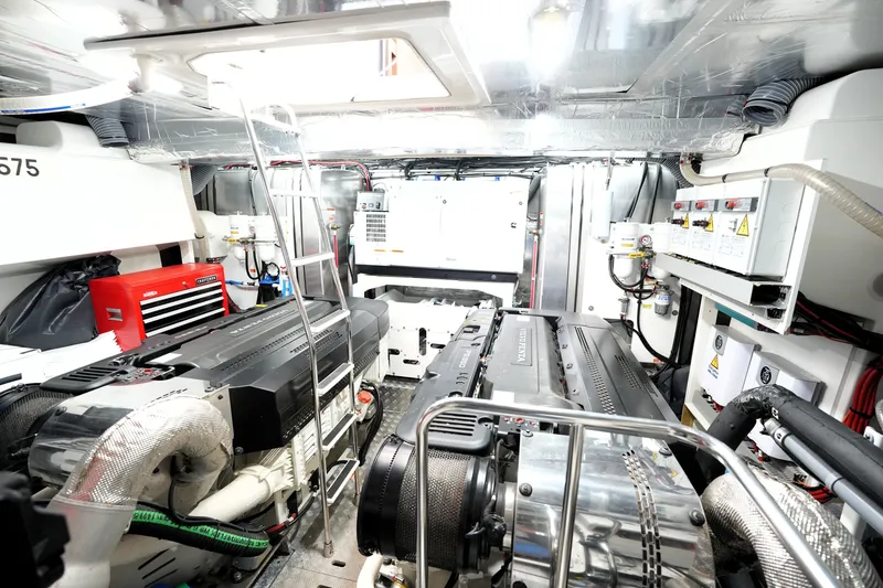 Slide: The Image of Engine room of 2023 Prestige 690 yacht, featuring advanced machinery and equipment. - 125