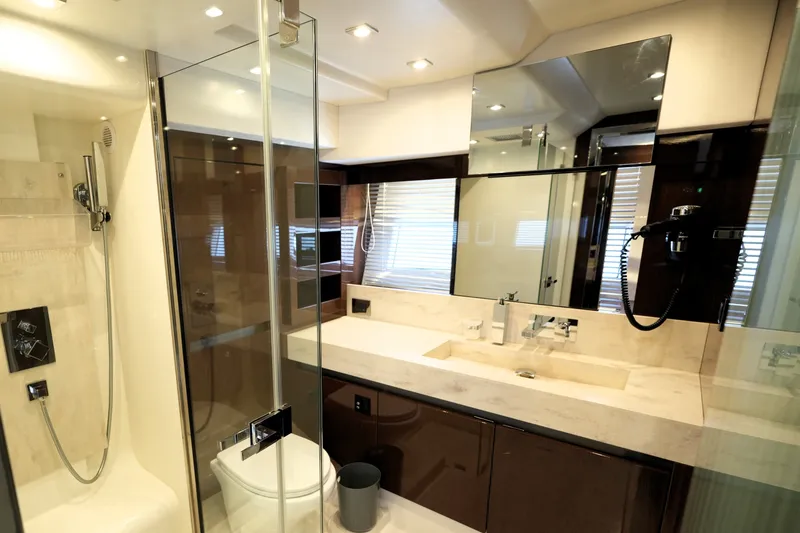 Slide: The Image of Luxurious bathroom in 2023 Prestige 690 yacht with modern fixtures and elegant design. - 97