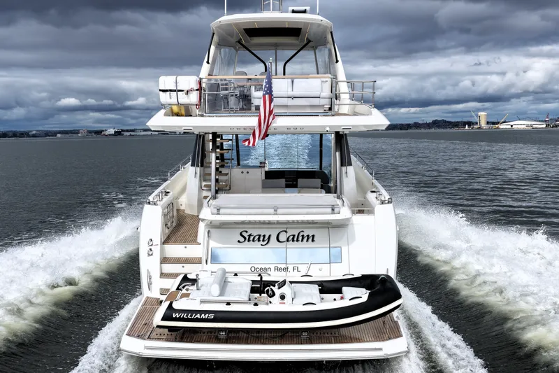 Slide: The Image of 2023 Prestige 690 yacht "Stay Calm" cruising with tender, Ocean Reef, FL. - 10