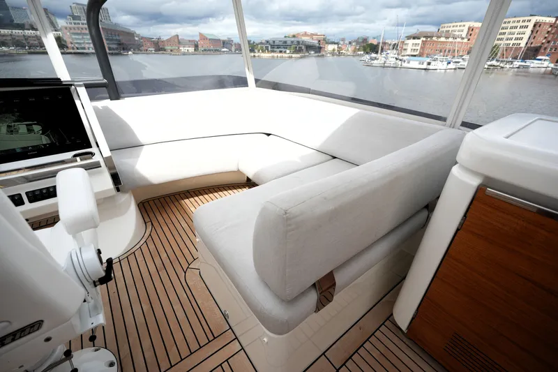 Slide: The Image of Luxurious interior of 2023 Prestige 690 yacht with elegant seating and scenic waterfront view. - 40