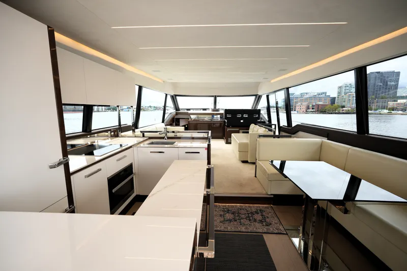 Slide: The Image of Luxurious interior of 2023 Prestige 690 yacht with modern kitchen and seating area. - 50
