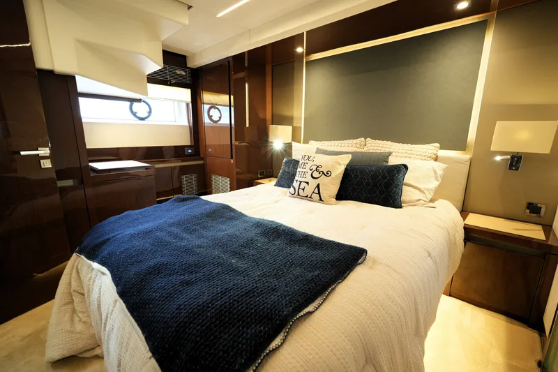 Slide: The Image of Luxurious bedroom interior of 2023 Prestige 690 yacht with elegant bedding and decor. - 105