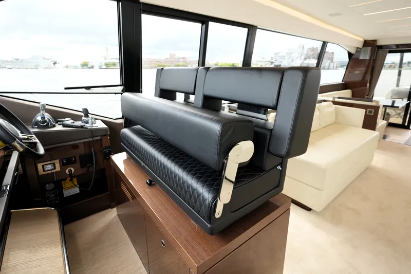 Slide: The Image of Luxurious interior of 2023 Prestige 690 yacht with leather seating and panoramic windows. - 76