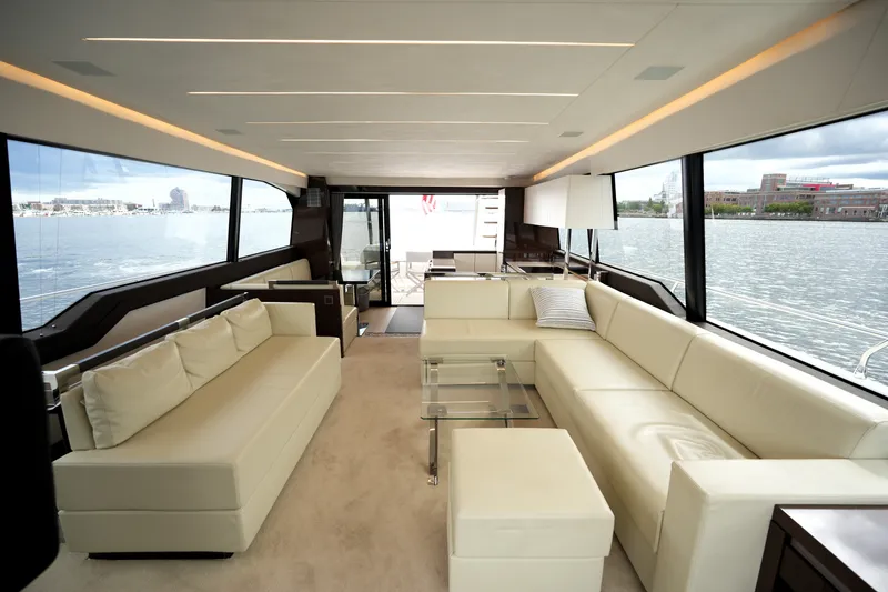 Slide: The Image of Luxurious interior of 2023 Prestige 690 yacht with elegant seating and panoramic windows. - 51