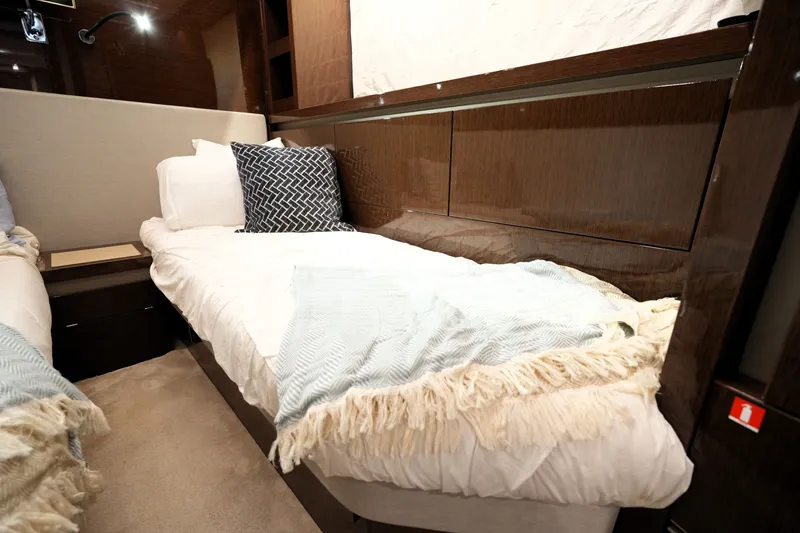 Slide: The Image of Luxurious 2023 Prestige 690 yacht cabin with cozy twin beds and elegant decor. - 115