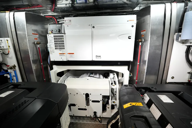 Slide: The Image of Engine room of 2023 Prestige 690 yacht featuring Cummins Onan generator. - 133