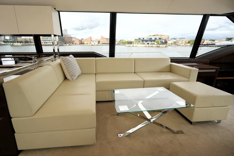 Slide: The Image of Luxurious interior of 2023 Prestige 690 yacht with cream leather sofa and glass table. - 65