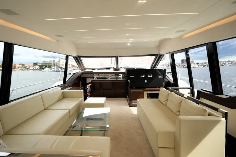 Slide: The Image of Luxurious interior of 2023 Prestige 690 yacht with panoramic windows and elegant seating. - 64