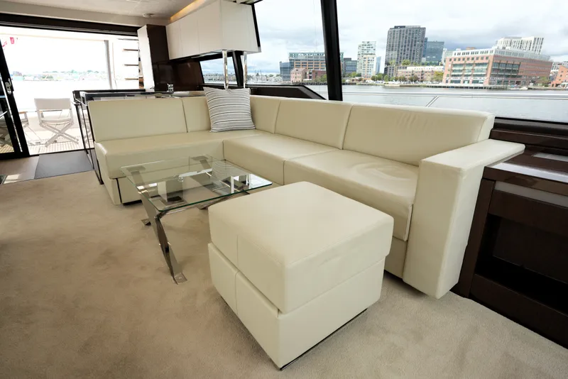 Slide: The Image of Luxurious interior of 2023 Prestige 690 yacht with cream leather sofa and glass table. - 66