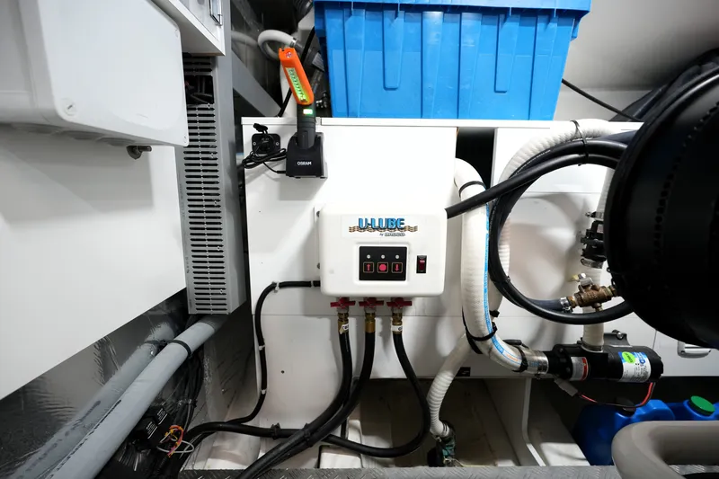 Slide: The Image of Engine room of 2023 Prestige 690 yacht with technical equipment and wiring. - 136