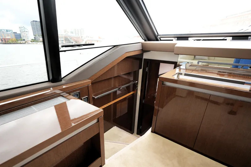 Slide: The Image of Interior of 2023 Prestige 690 yacht with sleek wood finishes and modern design. - 85