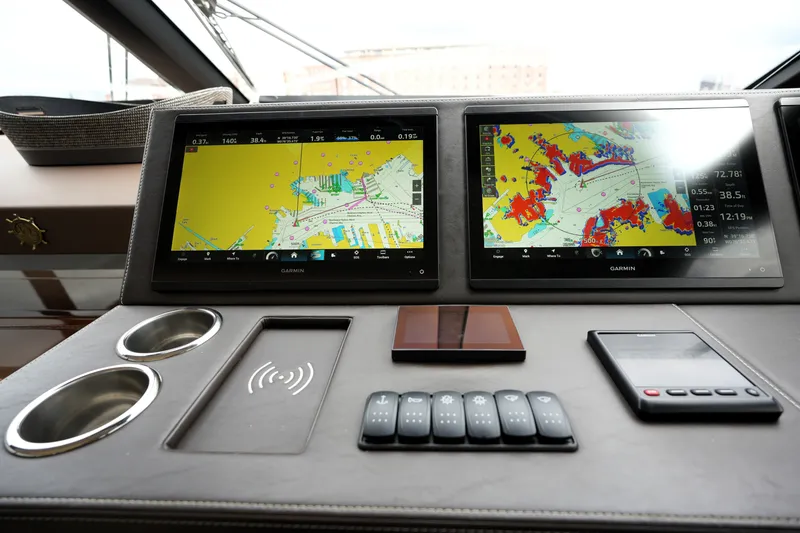 Slide: The Image of Dashboard of 2023 Prestige 690 yacht with dual Garmin navigation screens. - 81