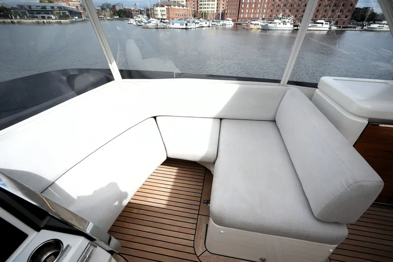 Slide: The Image of Luxurious seating area on 2023 Prestige 690 yacht with waterfront view. - 41