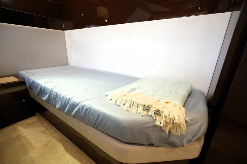Slide: The Image of Luxurious 2023 Prestige 690 yacht cabin with cozy bed and soft blanket. - 120