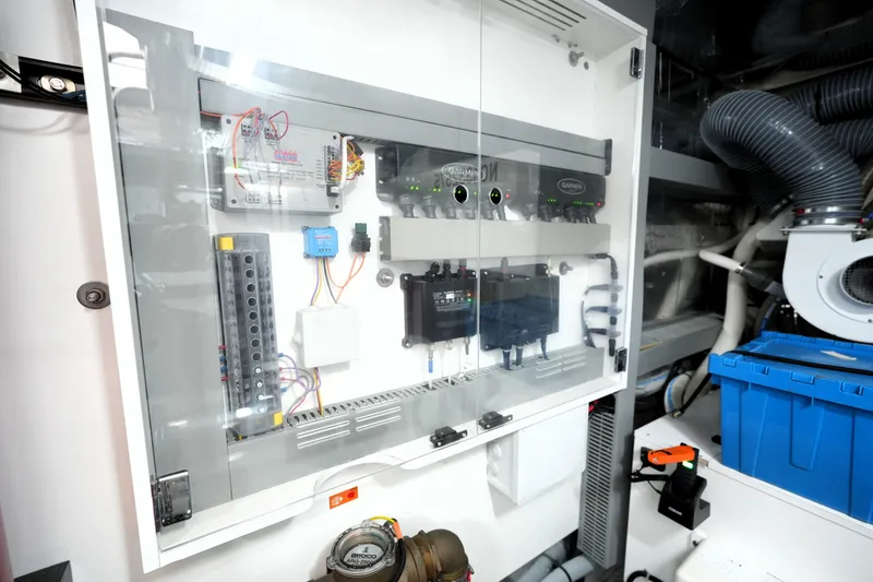 Slide: The Image of Electrical control panel in a 2023 Prestige 690 yacht engine room. - 134