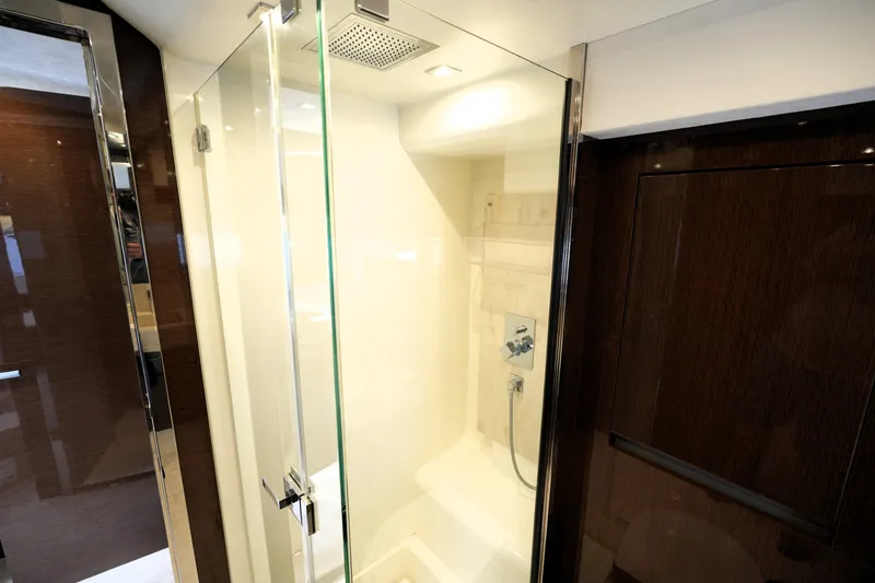 Slide: The Image of Luxurious bathroom shower in 2023 Prestige 690 yacht, featuring sleek glass doors and modern fixtures. - 98