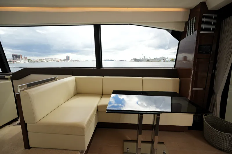 Slide: The Image of Luxurious interior of 2023 Prestige 690 yacht with cream seating and ocean view. - 63
