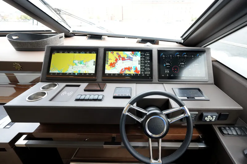 Slide: The Image of Modern helm of 2023 Prestige 690 yacht with advanced navigation displays. - 79