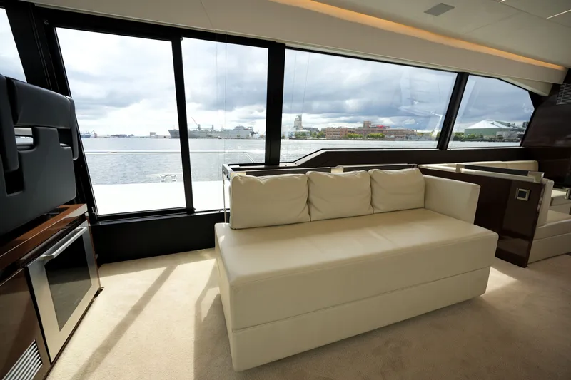 Slide: The Image of Luxurious interior of 2023 Prestige 690 yacht with elegant seating and panoramic windows. - 68