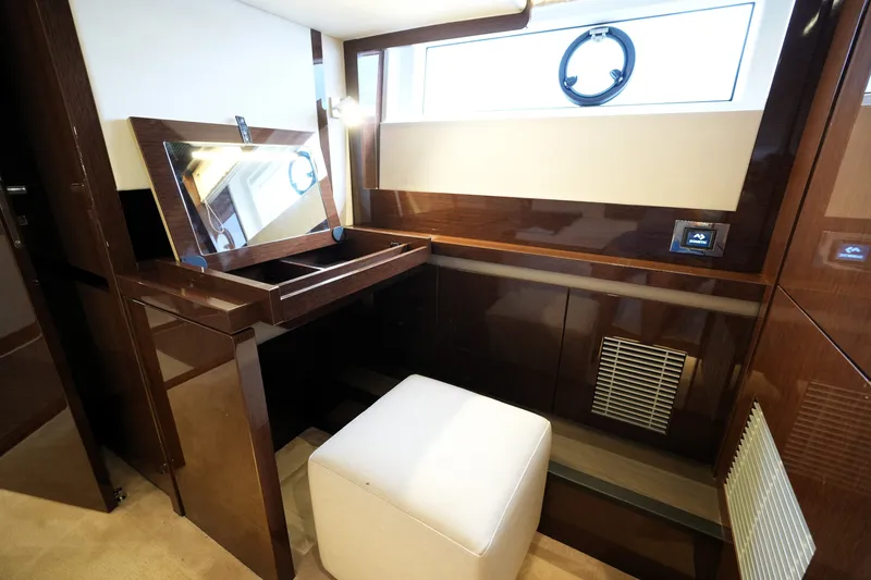 Slide: The Image of Luxurious interior of 2023 Prestige 690 yacht with elegant vanity and seating. - 110