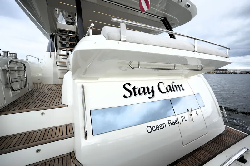 Slide: The Image of Luxury 2023 Prestige 690 yacht named "Stay Calm" docked at Ocean Reef, FL. - 16