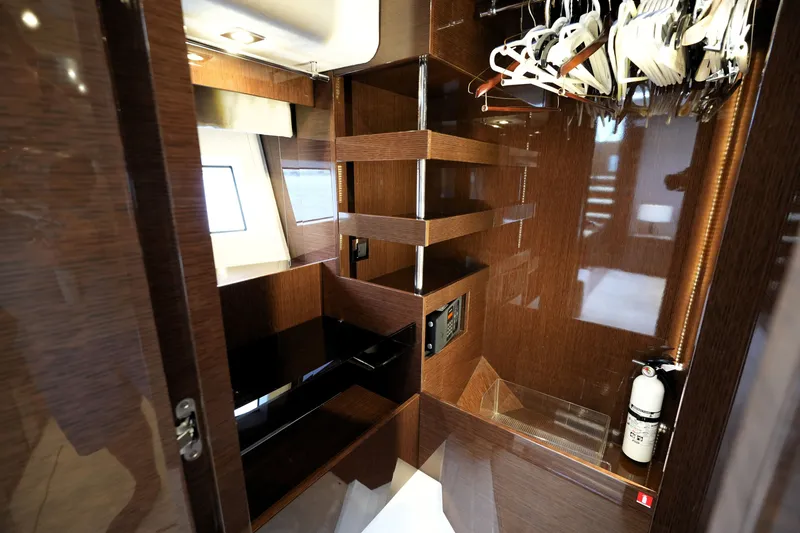 Slide: The Image of Luxurious interior of 2023 Prestige 690 yacht with wooden finish and modern amenities. - 96
