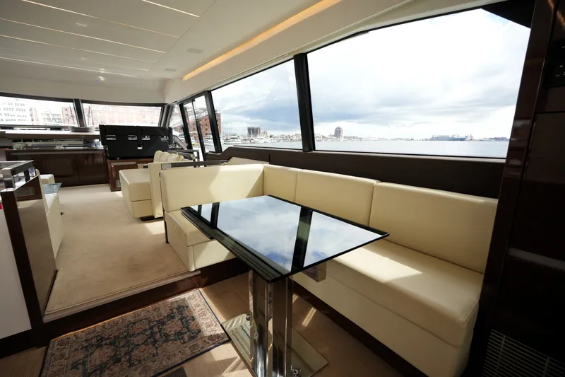 Slide: The Image of Luxurious interior of 2023 Prestige 690 yacht with elegant seating and panoramic windows. - 62