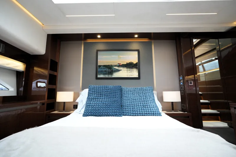Slide: The Image of Luxurious bedroom interior of 2023 Prestige 690 yacht with elegant decor and modern lighting. - 91