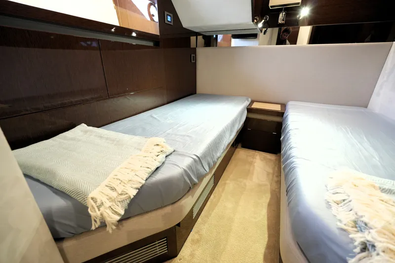 Slide: The Image of Luxurious twin cabin interior of 2023 Prestige 690 yacht with modern design. - 119