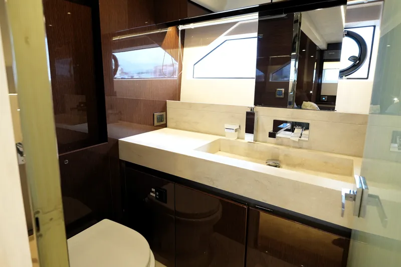 Slide: The Image of Luxurious bathroom interior of 2023 Prestige 690 yacht, featuring modern fixtures and elegant design. - 111