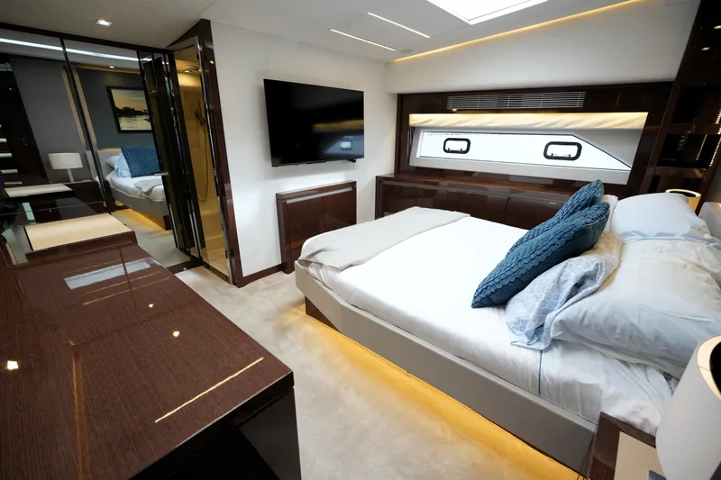 Slide: The Image of Luxurious bedroom interior of 2023 Prestige 690 yacht with modern furnishings and elegant design. - 88