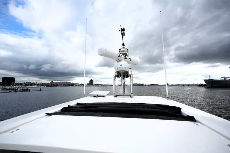 Slide: The Image of 2023 Prestige 690 yacht with Garmin equipment, cruising on a cloudy day. - 49