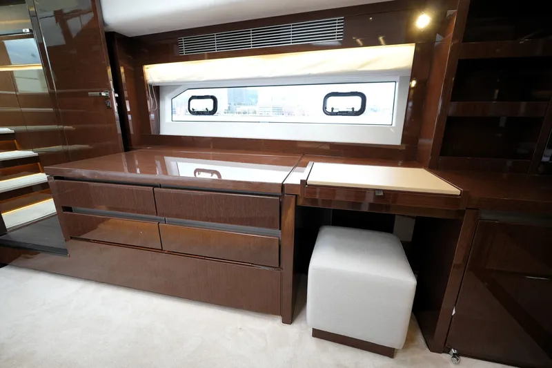 Slide: The Image of Luxurious interior of 2023 Prestige 690 yacht with sleek wooden cabinetry and modern design. - 94